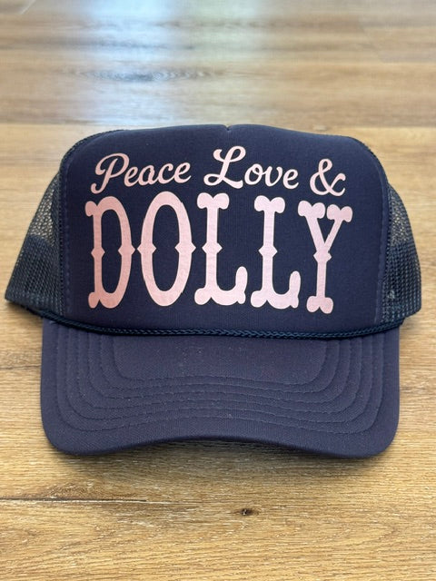 Peace Love and Dolly trucker hat in navy with pink and white lettering