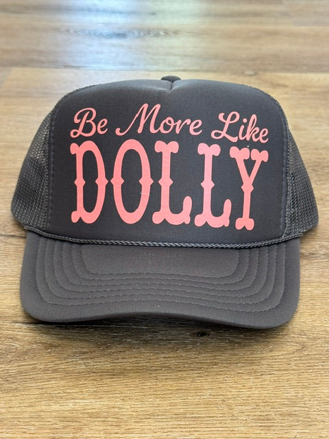 Be More Like Dolly trucker hat in charcoal with pink lettering